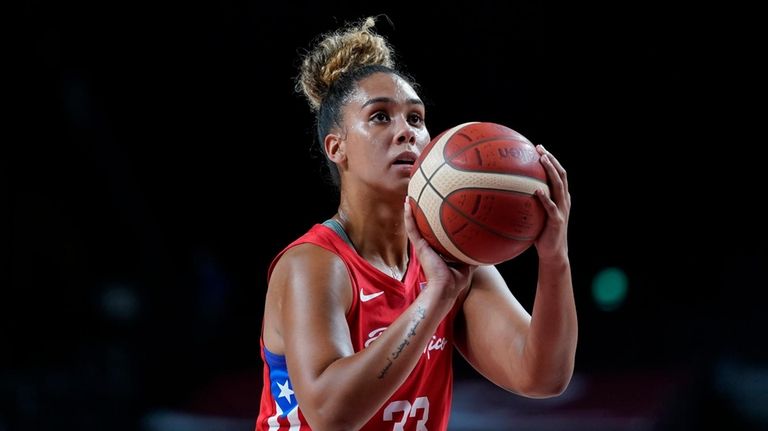 Puerto Rico's India Pagan prepares to shoot during women's basketball preliminary...