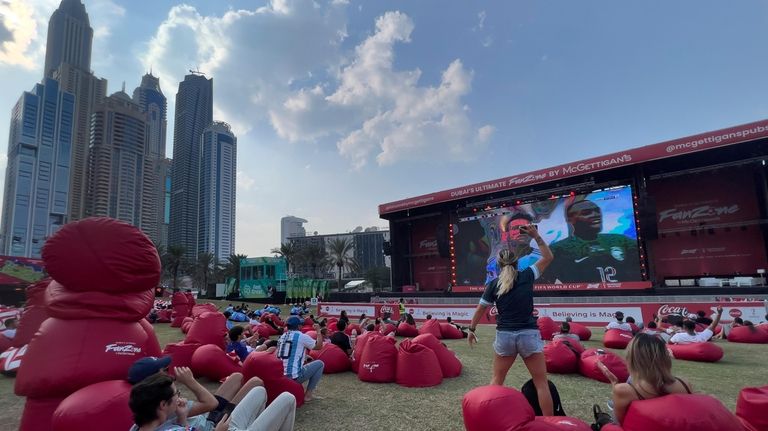 FILE - Soccer fans watch the World Cup Group C...