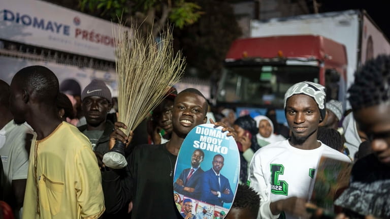 Supporters of presidential candidate Bassirou Diomaye Faye and Senegal's top...