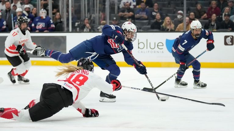 United States forward Britta Curl (17) shoots and scores against...