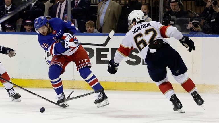 Artemi Panarin #10 of the New York Rangers shots the...