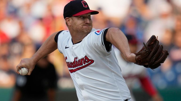 Cleveland Guardians' Alex Cobb pitches in the first inning of...