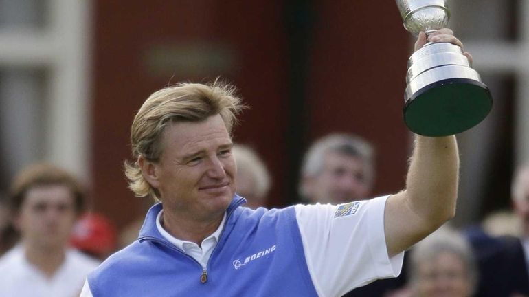 Ernie Els of South Africa holds up the Claret Jug...