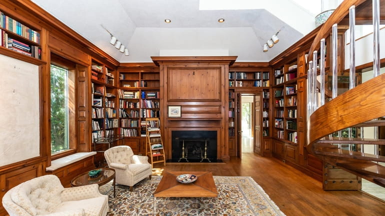 The library inside a Sands Point home listed for $9.9...
