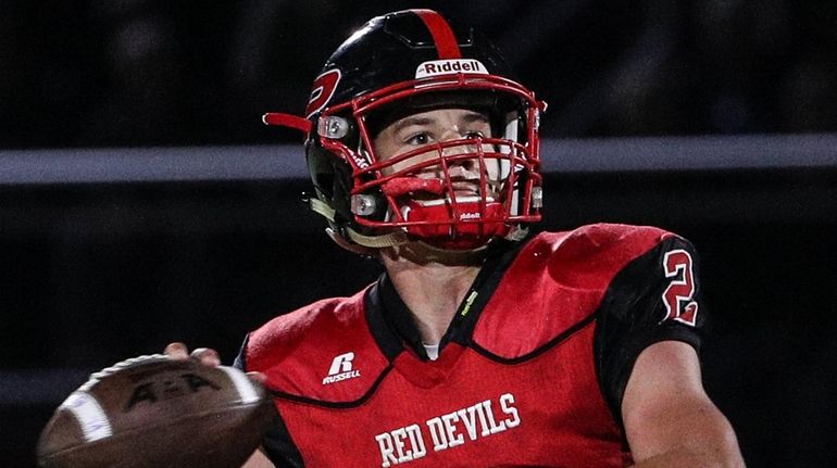 Plainedge quarterback Daniel Villari rears back to throw during the...