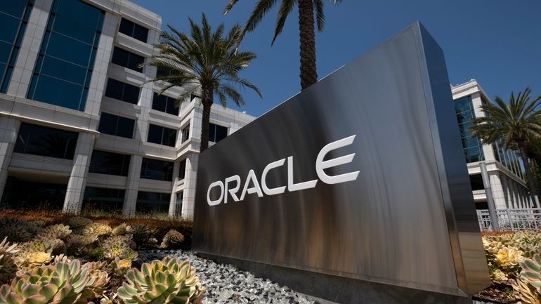 A sign for Oracle Corporation is seen outside their offices...