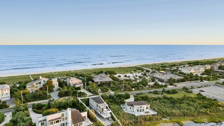 The home sits on a 0.19-acre lot on Dune Road.