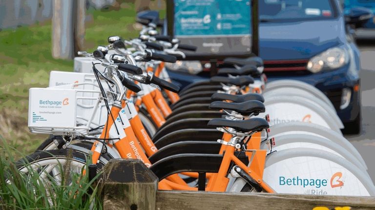 People using the new Babylon Village ride share bikes in...