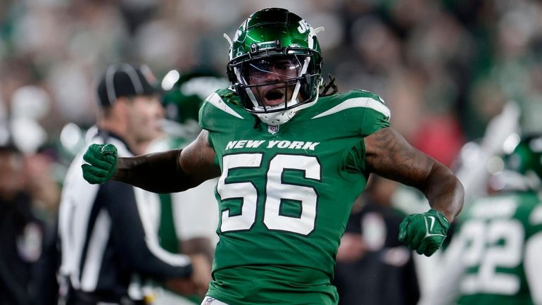 Quincy Williams #56 of the New York Jets reacts after...