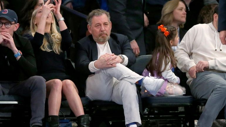 New York Knicks owner James Dolan, center, watches the second...