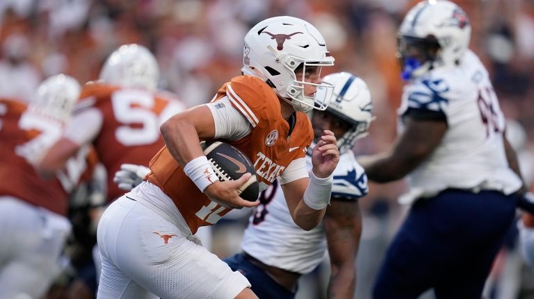 Texas quarterback Arch Manning (16) runs for a 67-yard touchdown...