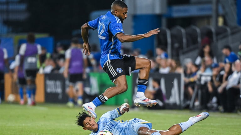 CF Montreal's Ruan, top, leaps over Atlanta United defender Ronald...