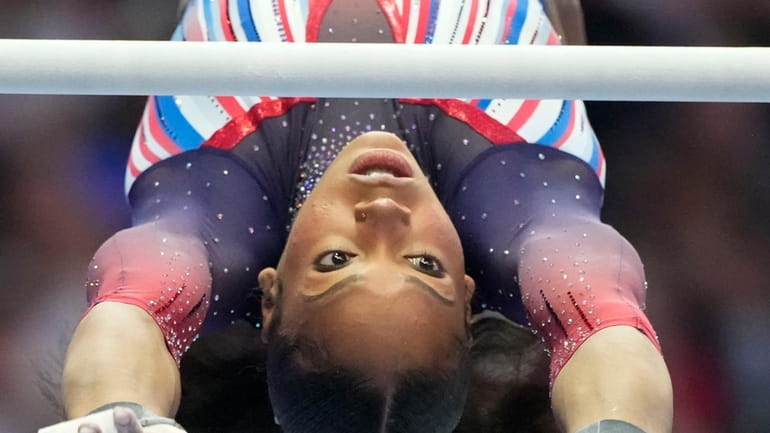 Shilese Jones competes on the uneven bars at the United...
