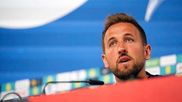 England's Harry Kane speaks during a press conference in Blankenhain,...