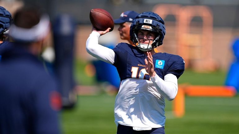 Denver Broncos quarterback Bo Nix takes part in drills at...