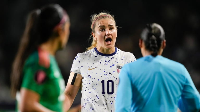 United States midfielder Lindsey Horan reacts while speaking to the...