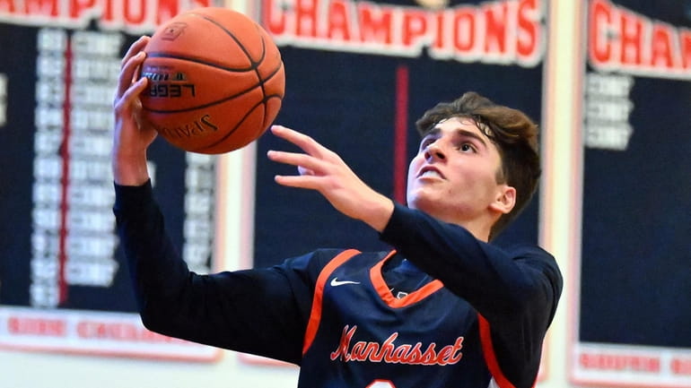 James Notias of Manhasset goes up for a shot in the second...