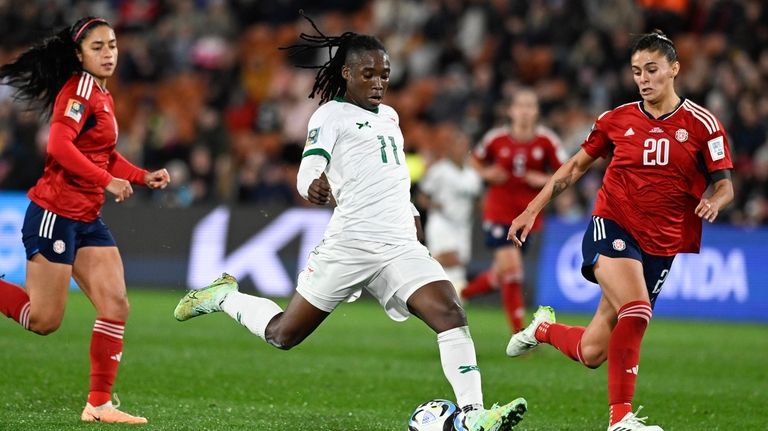 Zambia's Barbra Banda takes a shot on goal as Costa...