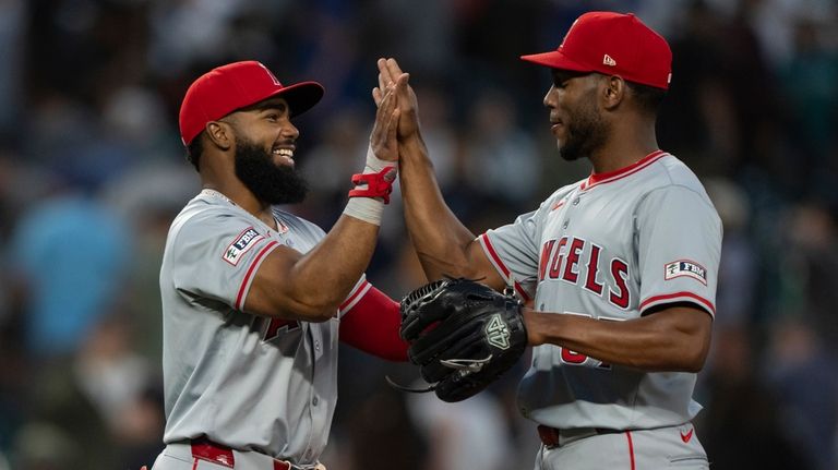 Los Angeles Angels' Luis Rengifo, left, and Roansy Contreras celebrate...