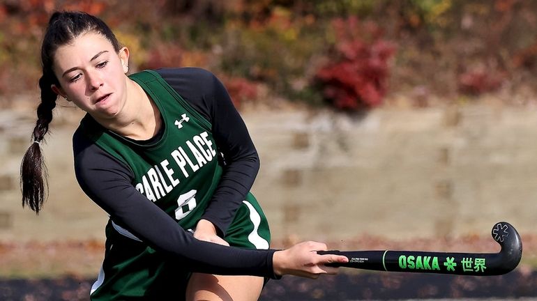 Carle Place midfielder Isabella Cunha clears the ball against Whitney...