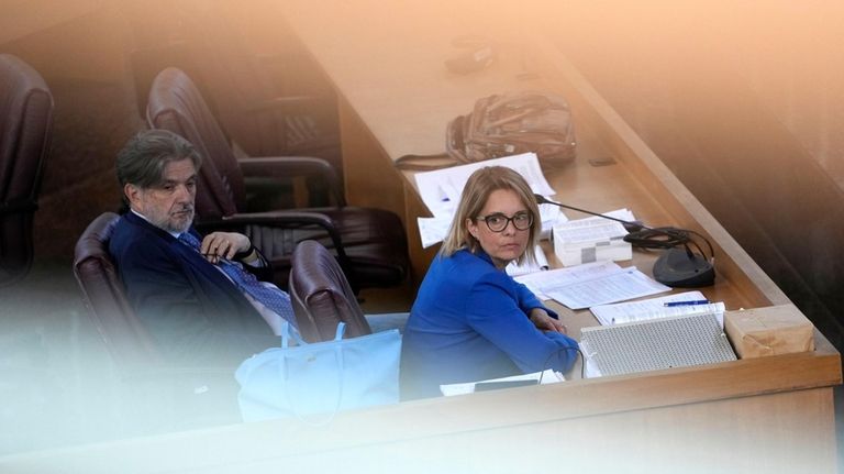 Prosecuting Magistrate Carmen Ruggiero sits in the in bunker hall...