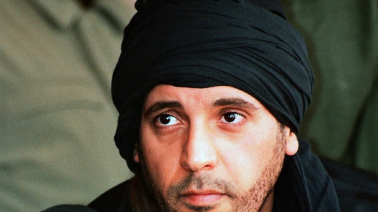 Hannibal Gadhafi, son of ousted Libyan leader Moammar Gadhafi, watches...