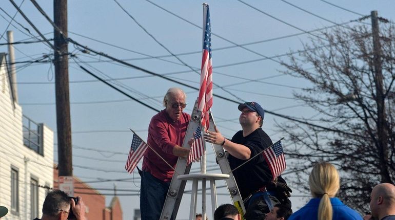 Long Beach resident Bill Murphy, 77, left, and firefighter Ed...