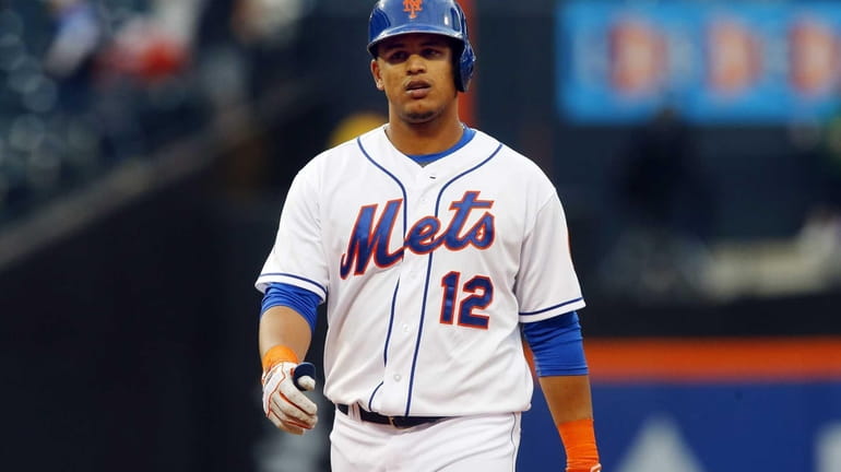 Juan Lagares of the Mets looks on after flying out...