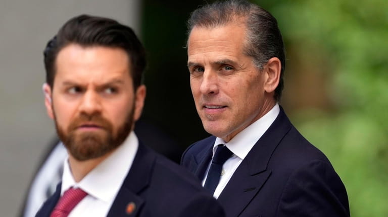 Hunter Biden, right, departs from federal court, Monday, June 10,...