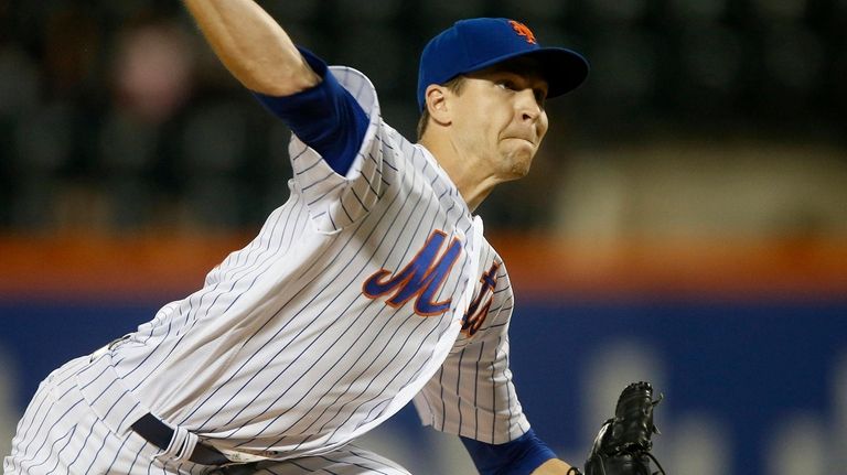 Mets pitcher Jacob deGrom delivers during the first inning against the...