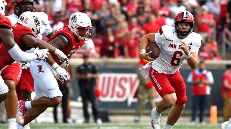 Jacksonville State quarterback Tyler Huff (6) attempts to get a...