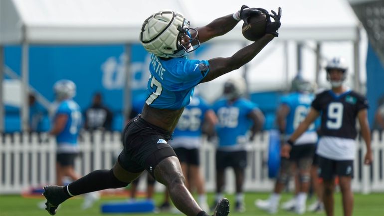 Carolina Panthers receiver Xavier Legette reaches for a catch during...