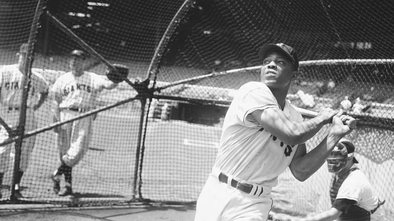New York Giants' Willie Mays, takes a batting practice swing...