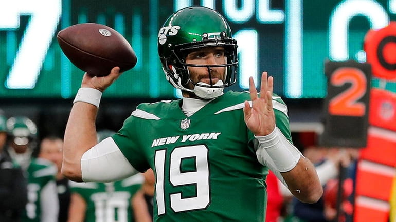Joe Flacco #19 of the Jets throws a pass during the...