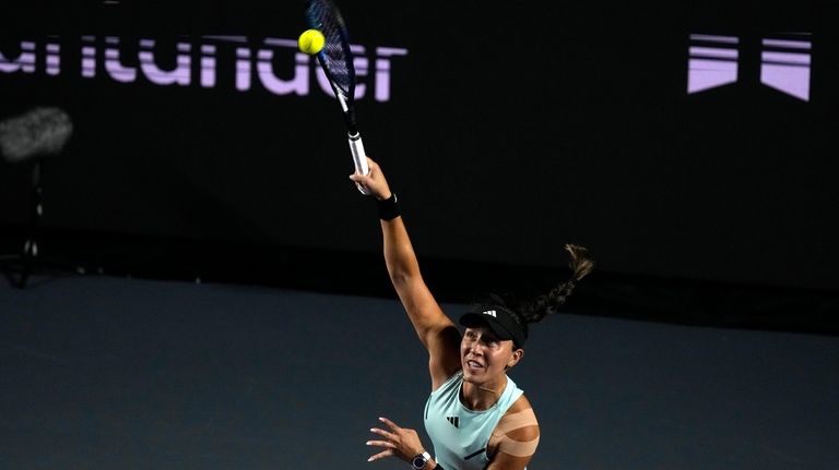 Jessica Pegula, of the United States, serves to Coco Gauff...