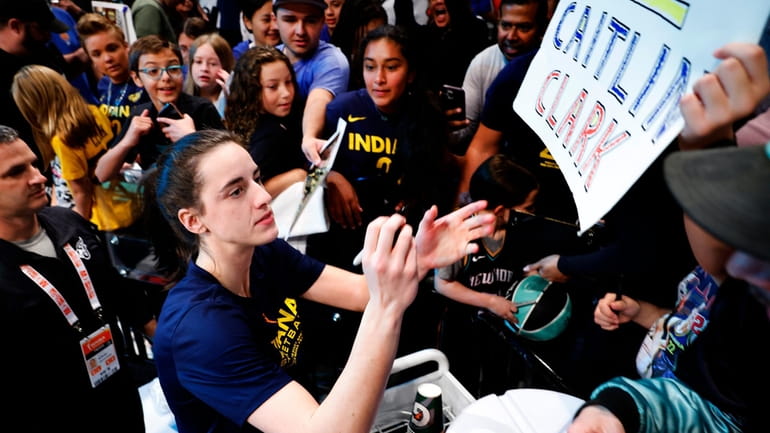 Indiana Fever guard Caitlin Clark signs autographs for fans before...