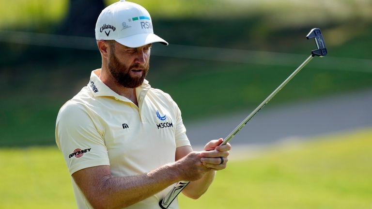 Chris Kirk lines up a putt on the sixth green...