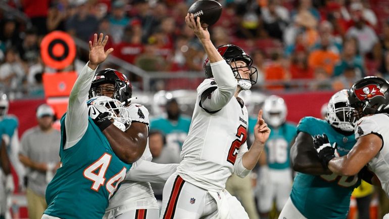 Tampa Bay Buccaneers quarterback Kyle Trask (2) aims a pass...