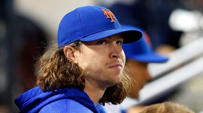 Jacob deGrom #48 of the New York Mets looks on...