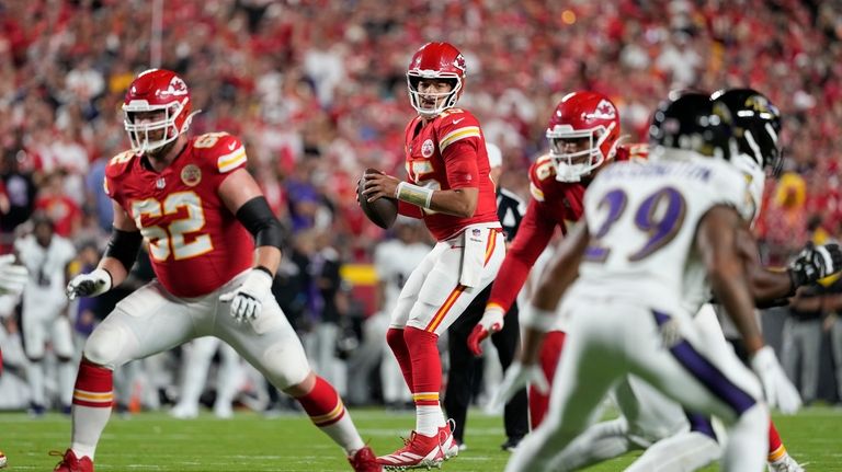 Kansas City Chiefs quarterback Patrick Mahomes drops back to pass...