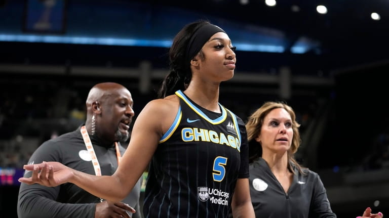 Chicago Sky's Angel Reese heads to the locker room after...