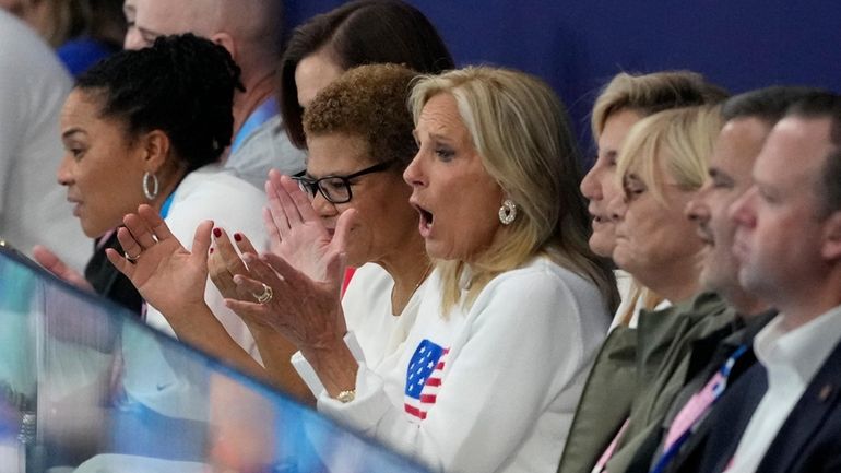 First lady Jill Biden watches a match during a women's...