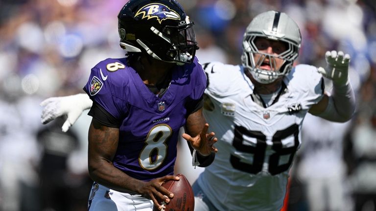 Las Vegas Raiders defensive end Maxx Crosby (98) chases after...