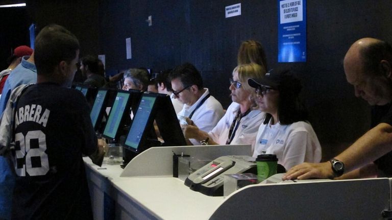 Workers at the FanDuel sports book at the Meadowlands Racetrack...