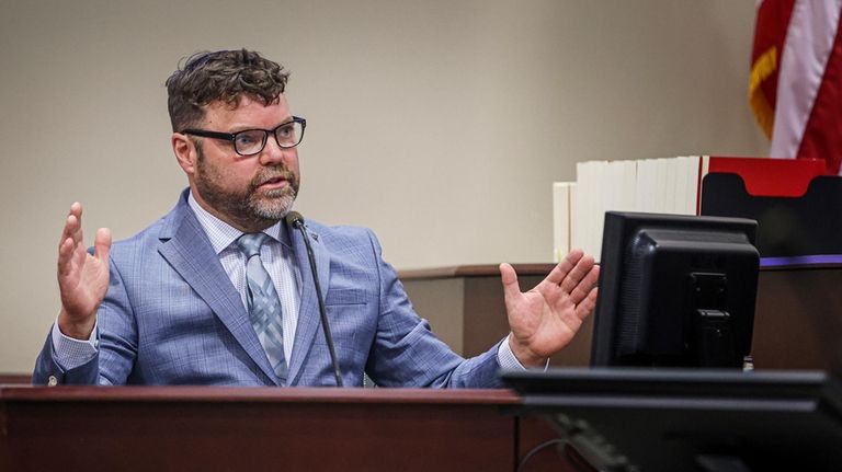 Bryan Carpenter, an expert witness in firearms safety, testifies during...