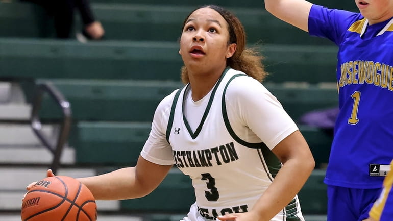 Westhampton guard Sandra Clarke drives to the outside for the...