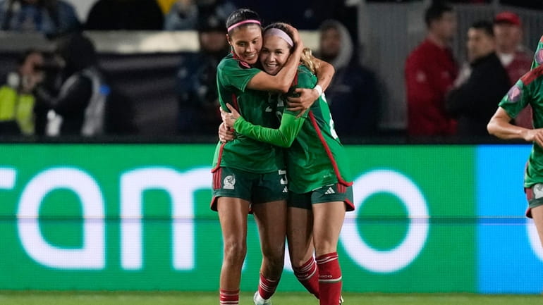 Mexico midfielder Mayra Pelayo-Bernal, right, celebrates her goal with defender...