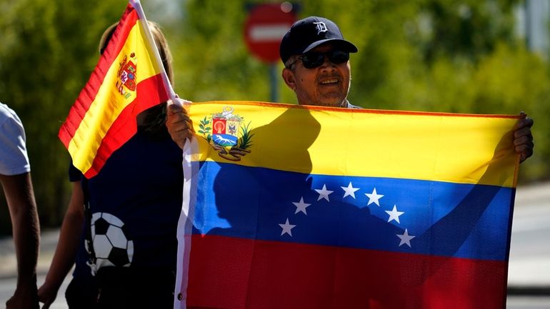 Supporters of Edmundo González gather outside the Torrejón Air Base...