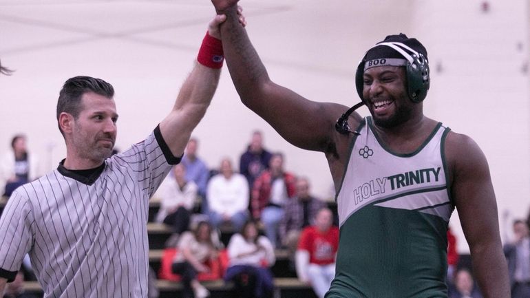 Hopeton James of Holy Trinity defeats Thomas Tyndorf of St. Joseph by-the-Sea...