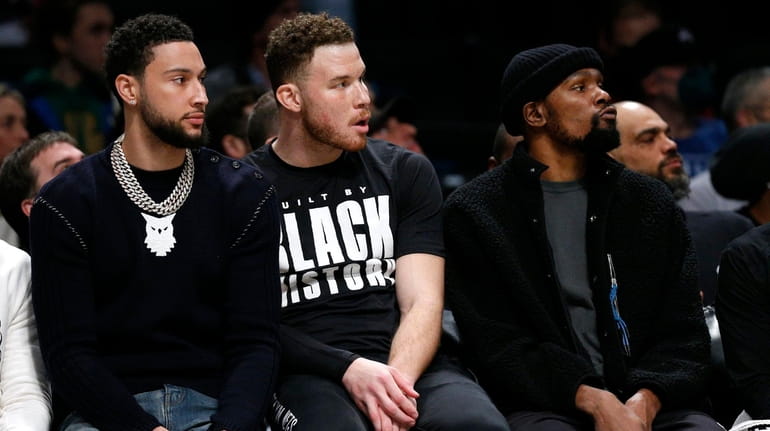 Brooklyn Nets' Ben Simmons, Blake Griffin and Kevin Durant watch...